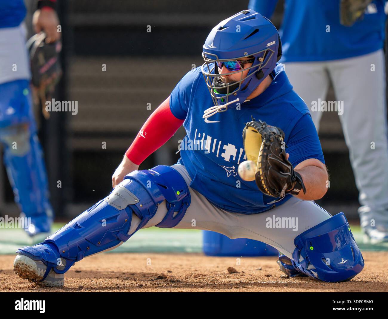 Toronto Blue Jays catcher Alejandro Kirk fields a throw to the plate ...
