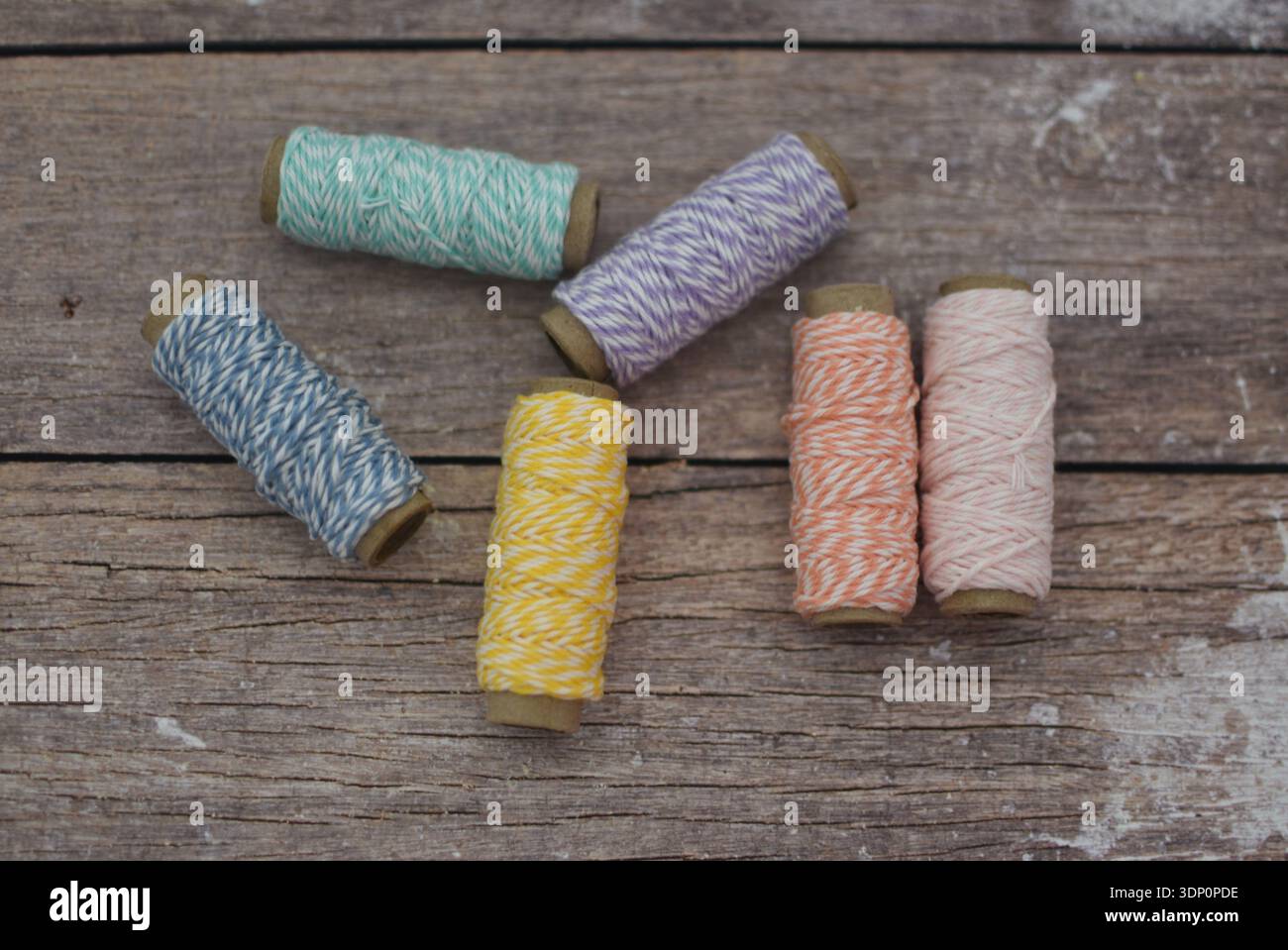 Colorful Thread Spools on Wooden Table, Top View Flat Lay Stock Photo