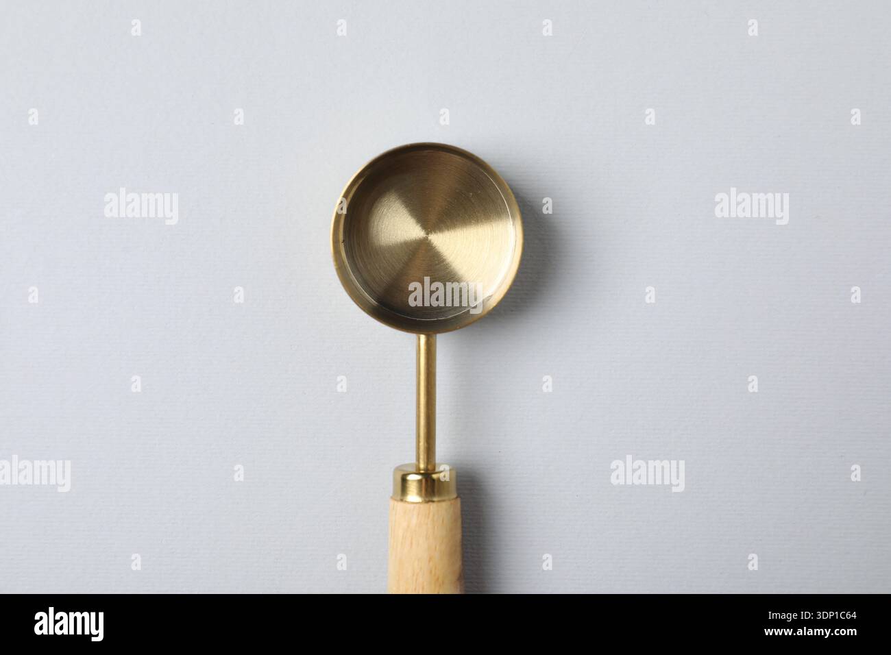 Golden scoop on light background, top view Stock Photo
