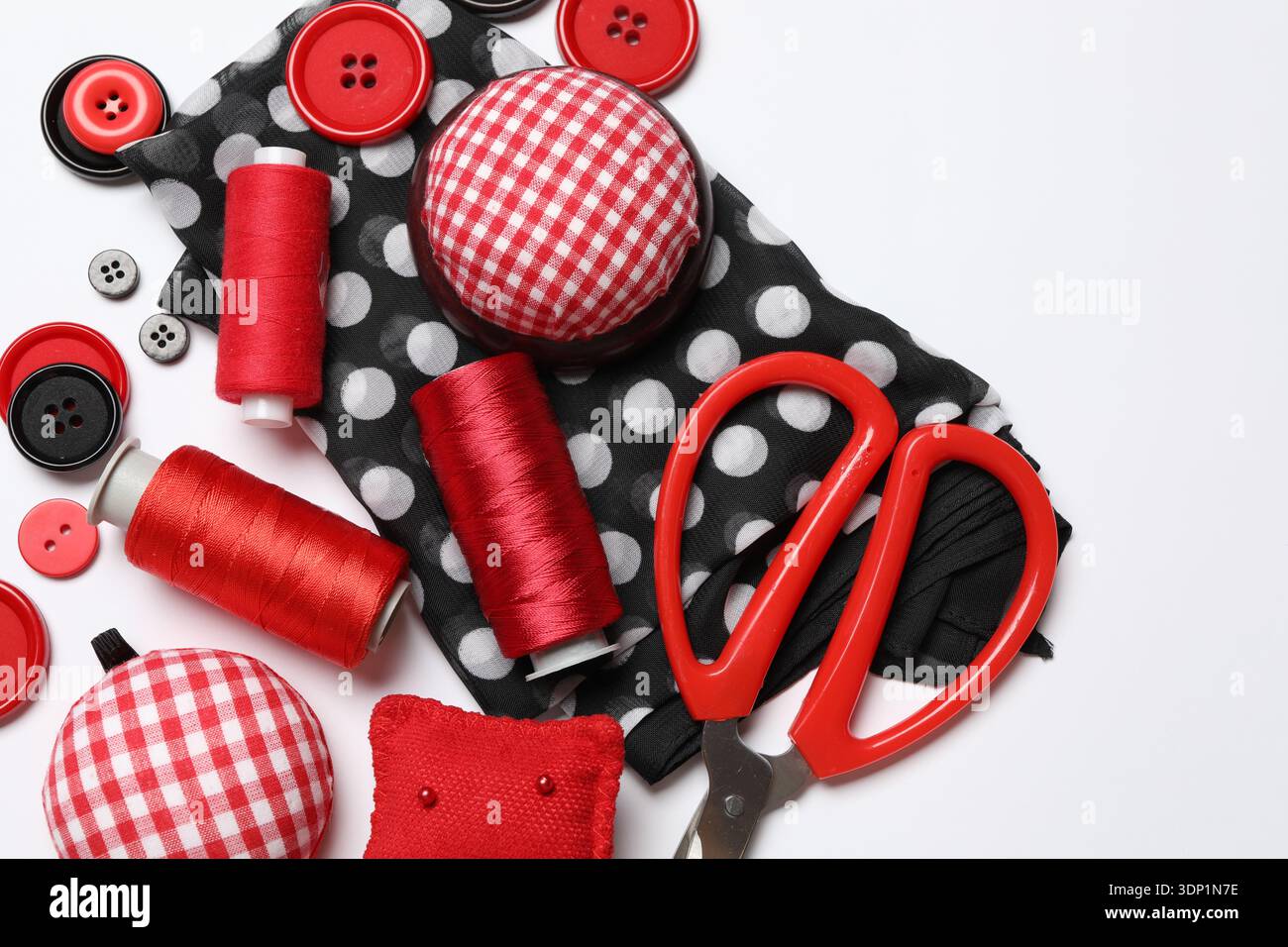 Different sewing supplies on white background, flat lay Stock Photo