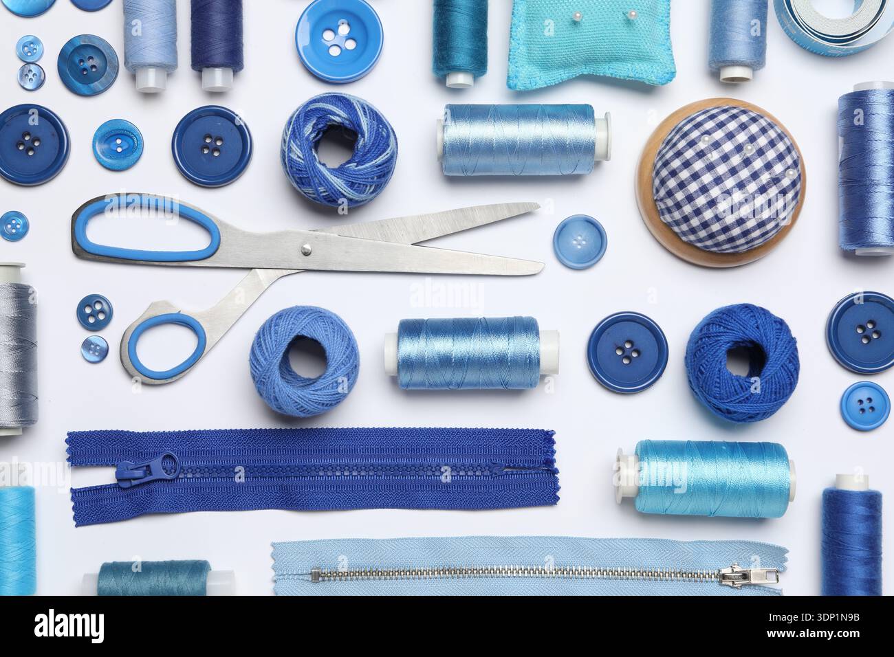 Flat lay composition with sewing supplies on white background Stock Photo