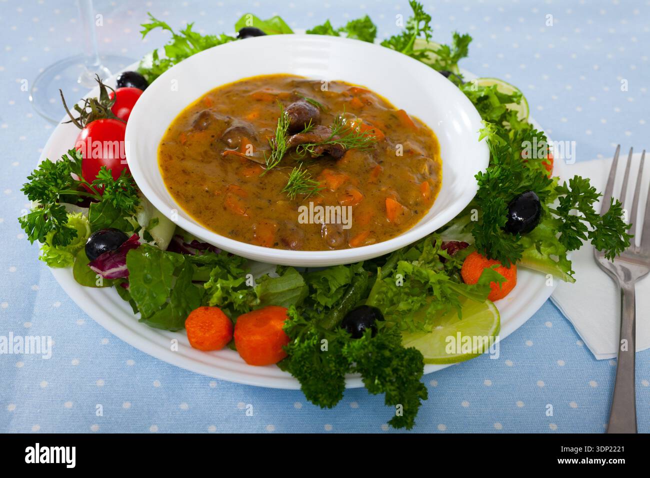 Delicious chicken hearts stew Stock Photo