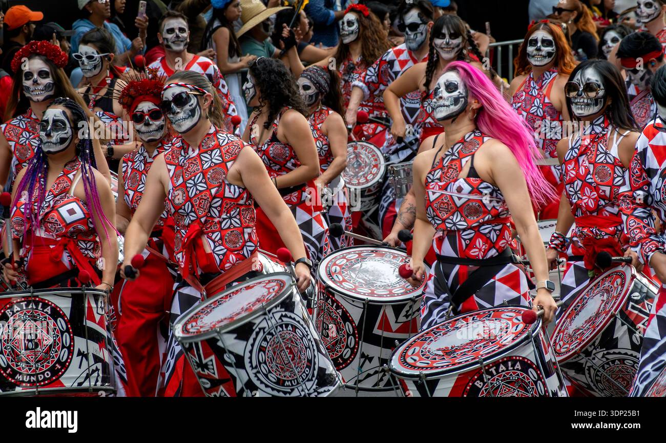 Female drummers with skull facepaint  perform in a Day of the Dead parade Mexico City, Mexico Stock Photo