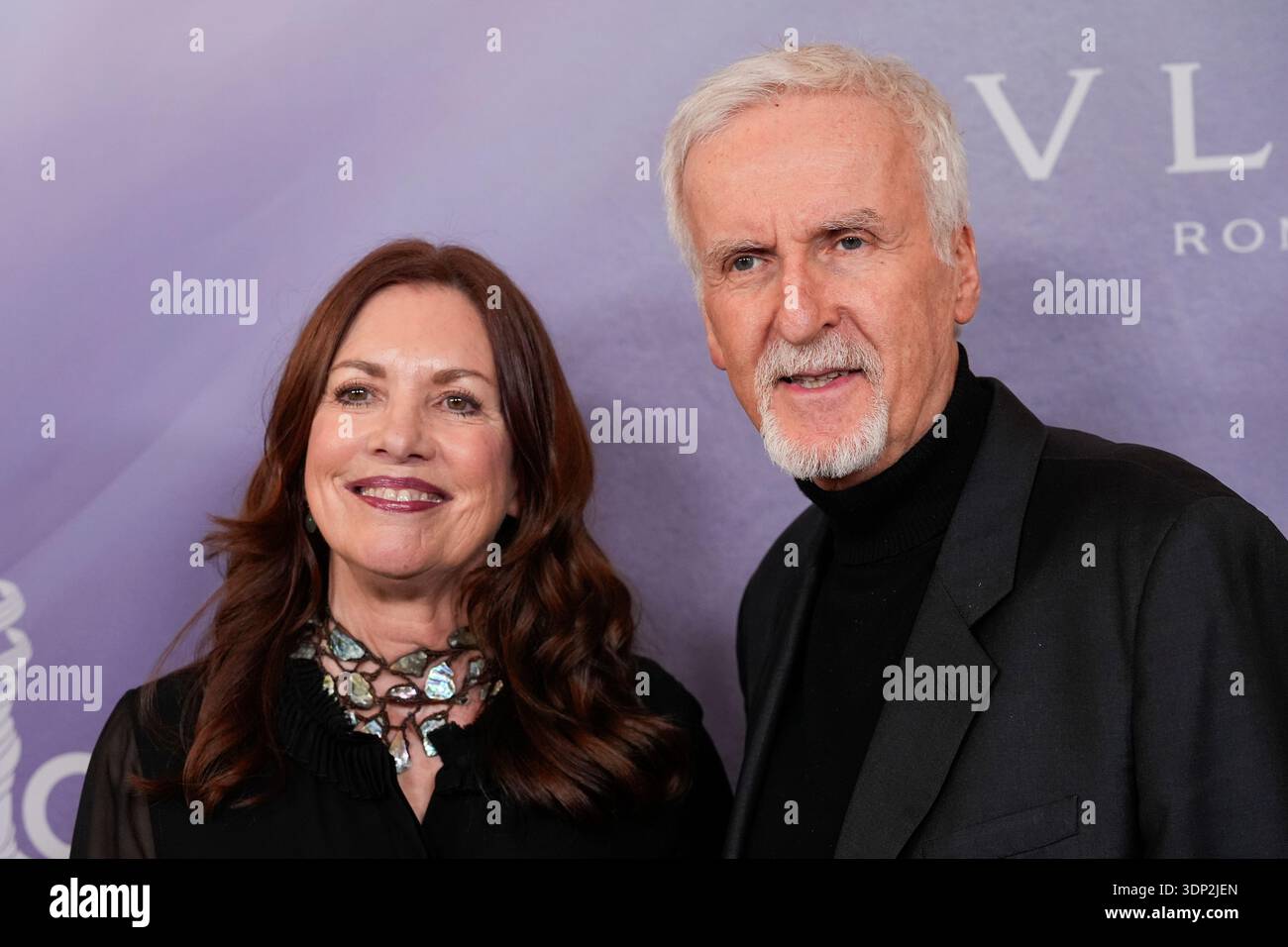 Deborah L. Scott, left, and James Cameron arrive at the 28th Costume ...