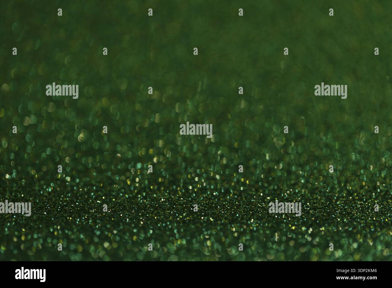 Green glitter texture holidays background. Macro shot Stock Photo