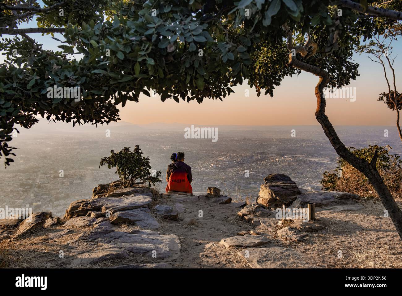 Couple looking at Lubango, Angola from above Stock Photo