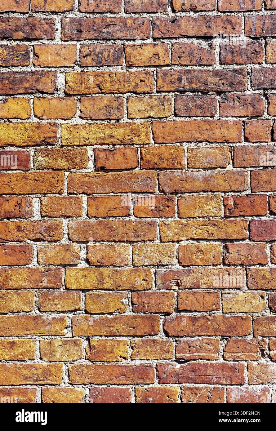 Old weathered red brick wall as creative background. Brick wall texture Stock Photo