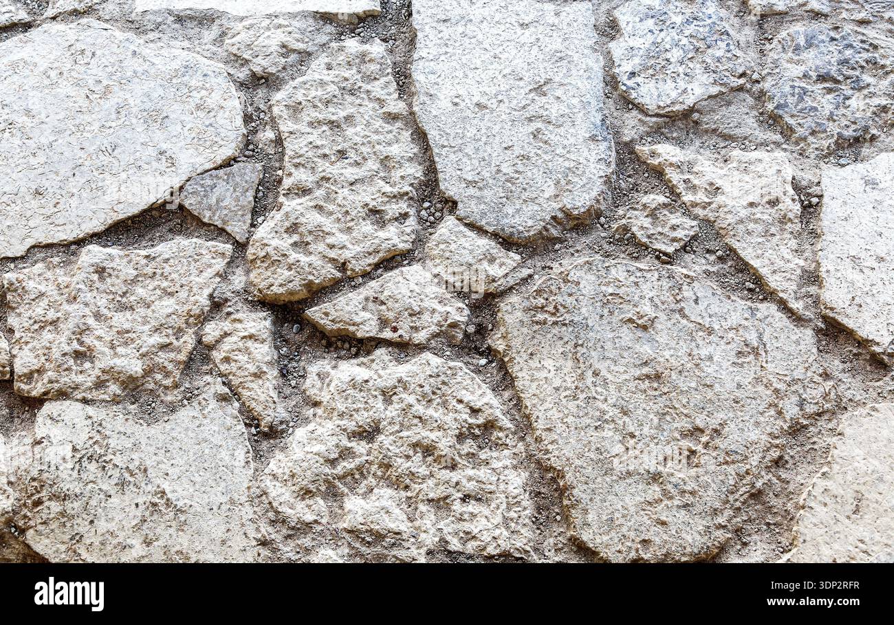 Rough gray stone wall as creative background. Grunge brick wall texture background Stock Photo