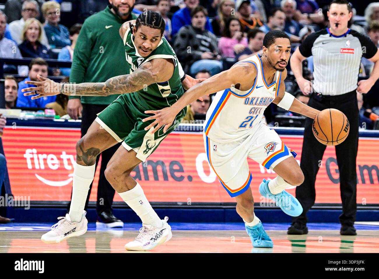 Oklahoma City Thunder guard Aaron Wiggins (21) drive pass Milwaukee ...