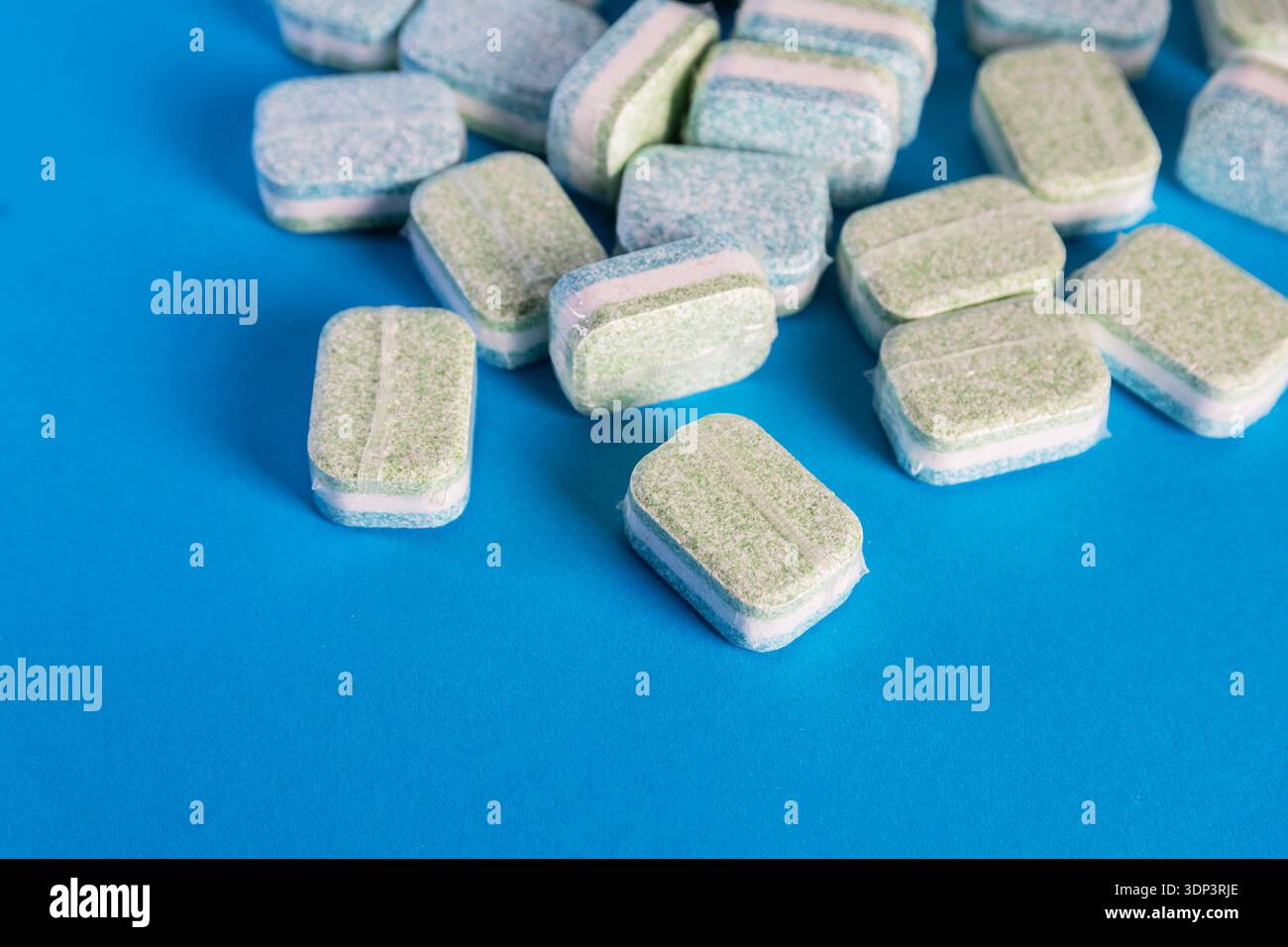 Close-up view of multiple dishwasher tablets. Each tablet individually ...