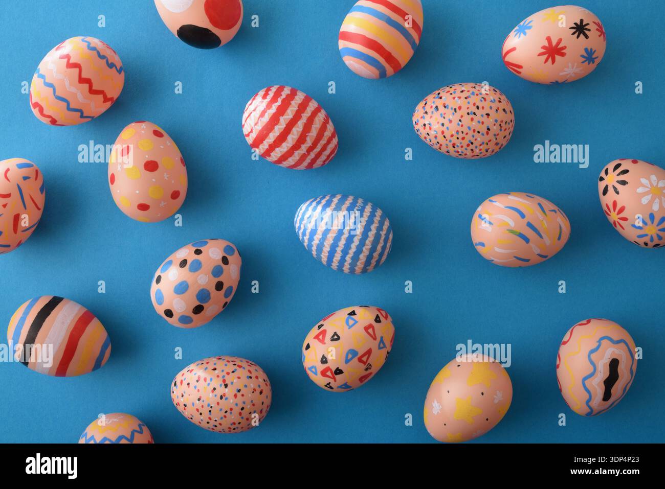 Colorful Patterned Easter Eggs on Blue Background Stock Photo
