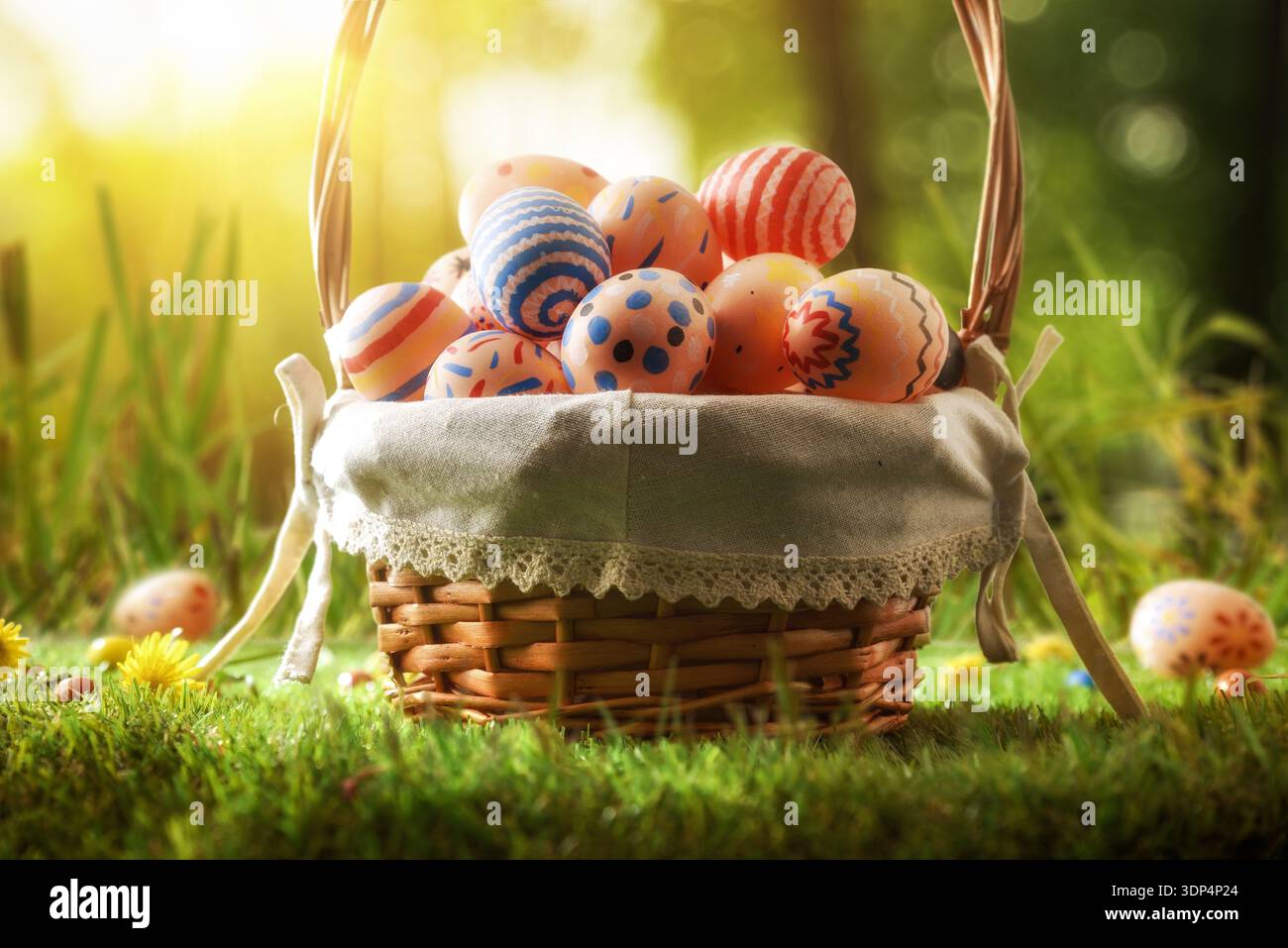 Easter Basket with Painted Eggs in Sunlight Stock Photo