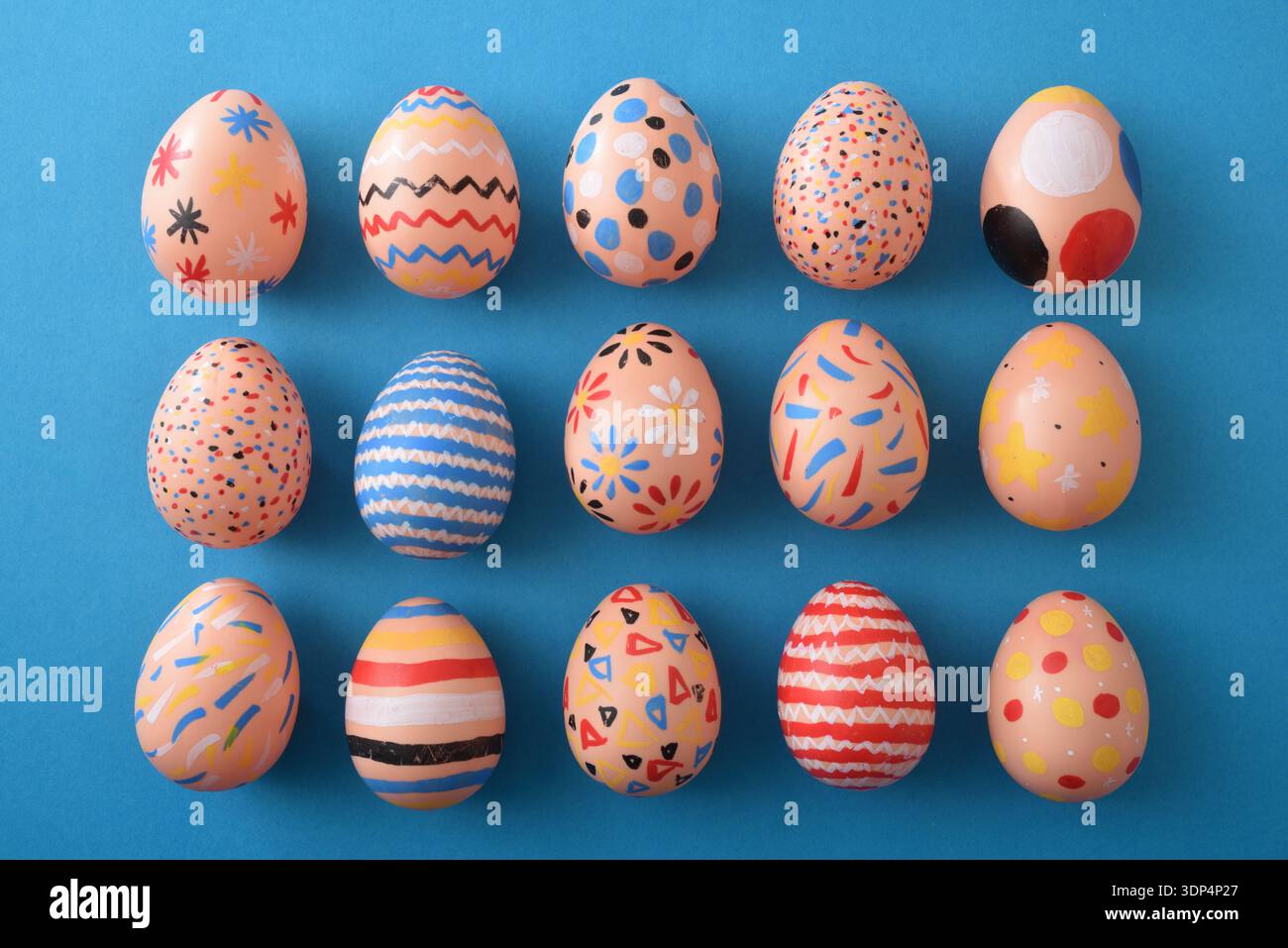 Assorted Hand-Painted Easter Eggs Flat Lay Stock Photo