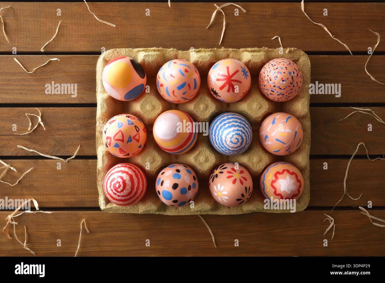 Colorful Hand-Painted Easter Eggs in Carton Stock Photo