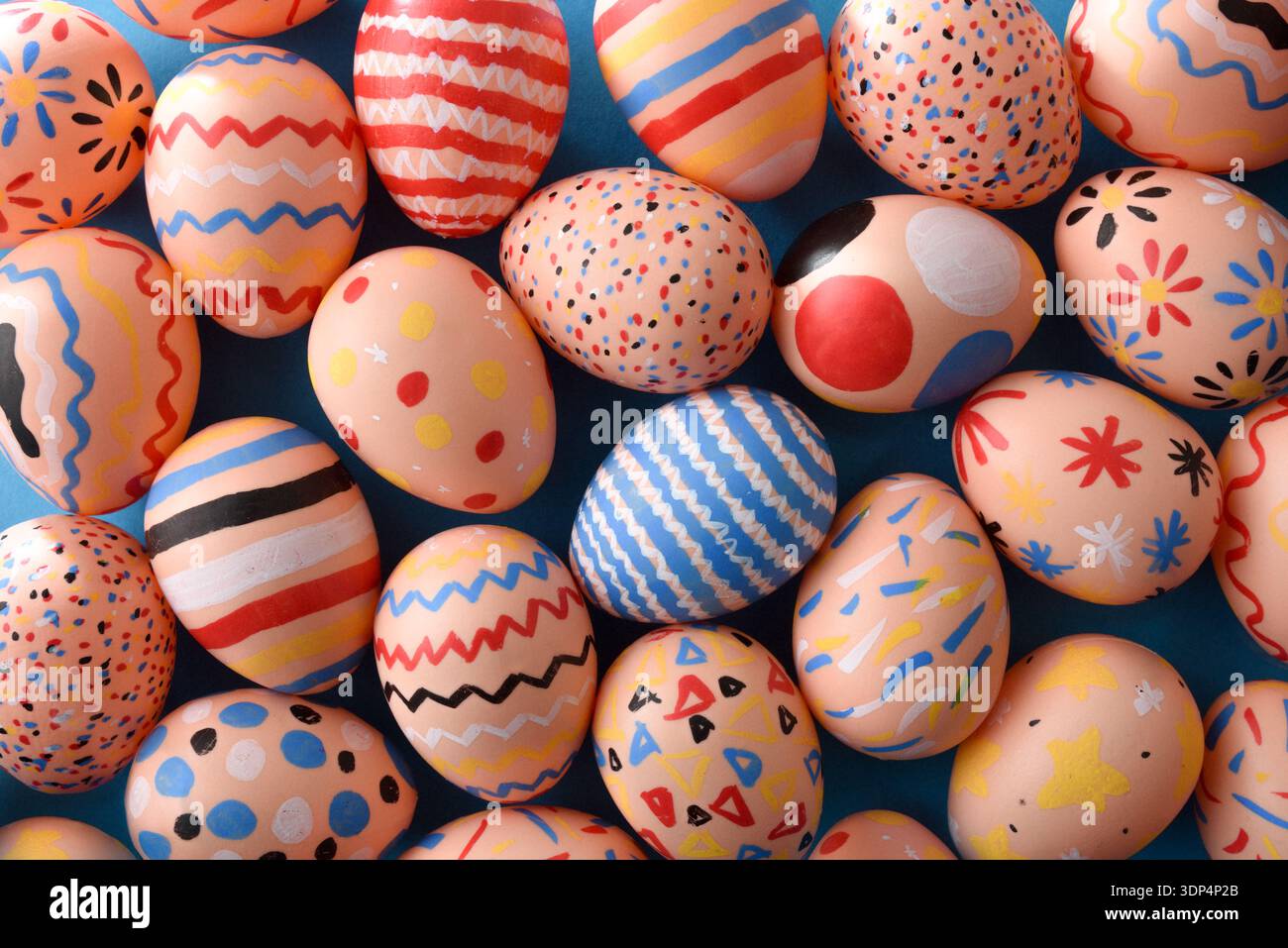 Bright Patterned Easter Eggs on Blue Background Stock Photo