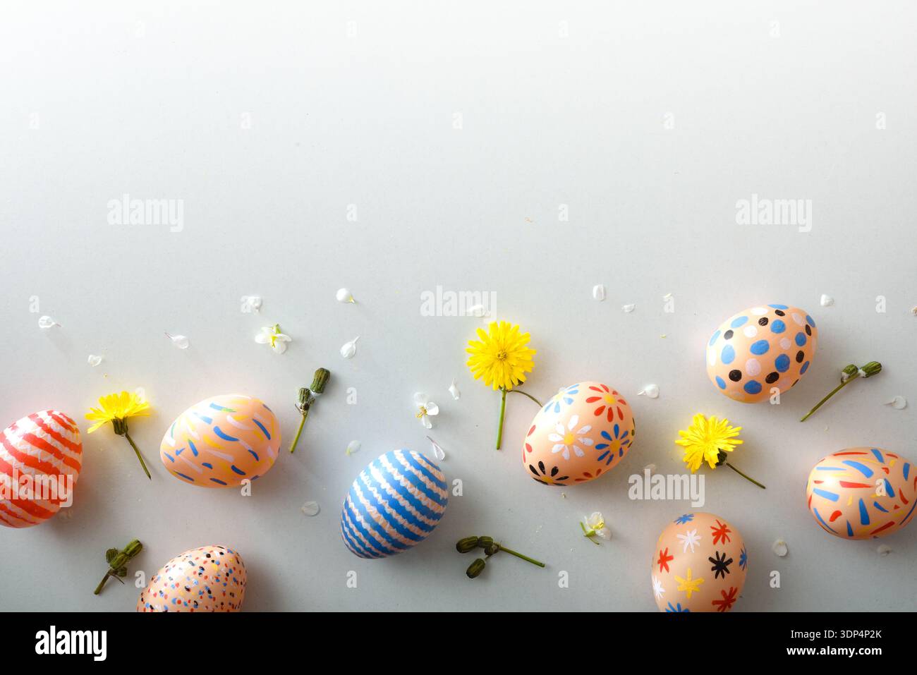 Decorated Easter Eggs with Spring Flowers Border Stock Photo