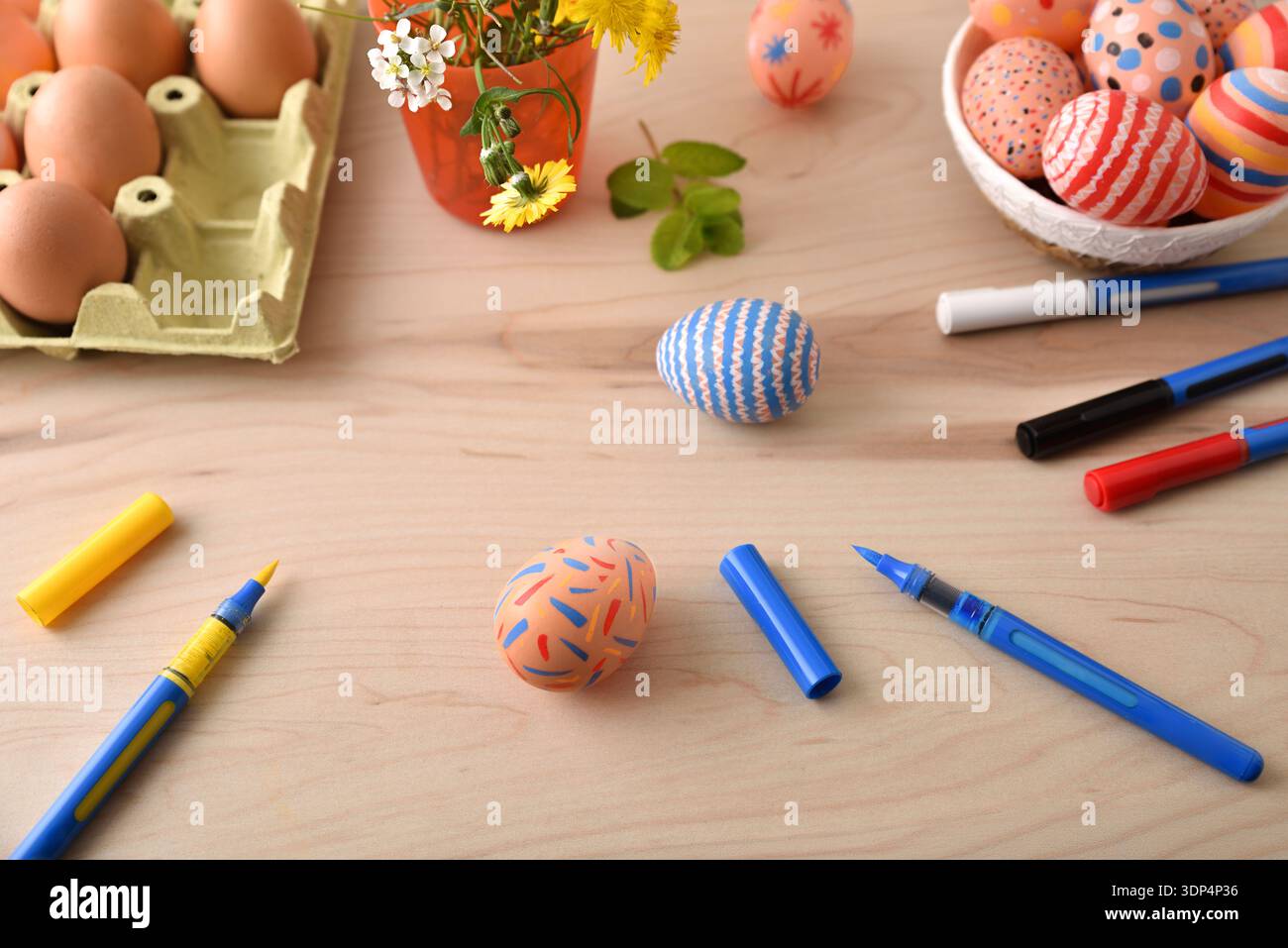 DIY Easter Egg Painting on Wooden Table Stock Photo