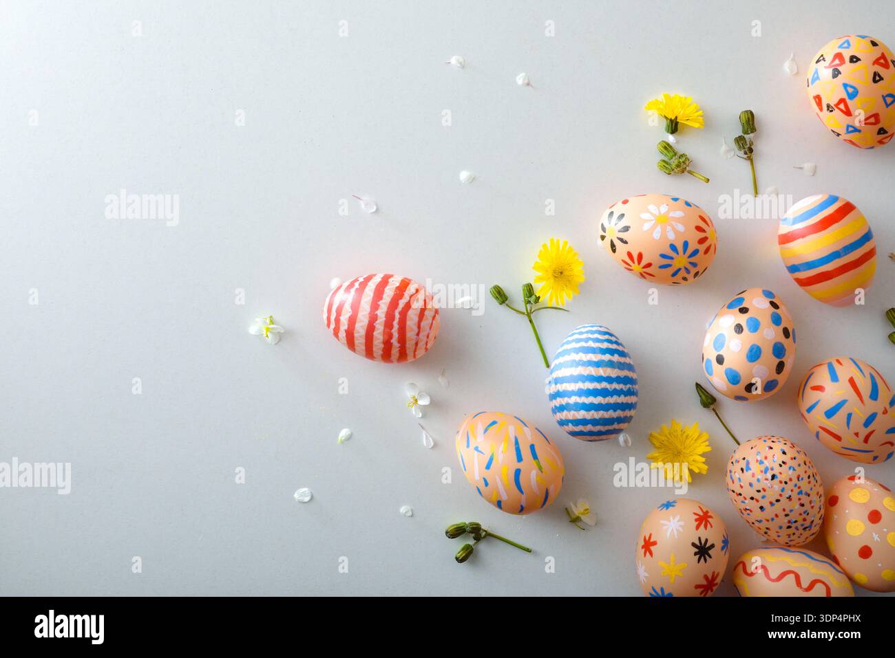 Scattered Painted Easter Eggs on Pastel Background Stock Photo