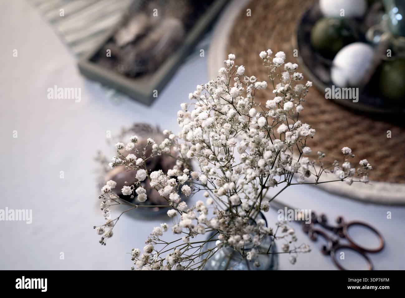 Rustic Easter still life with olive eggs and decor. Stock Photo