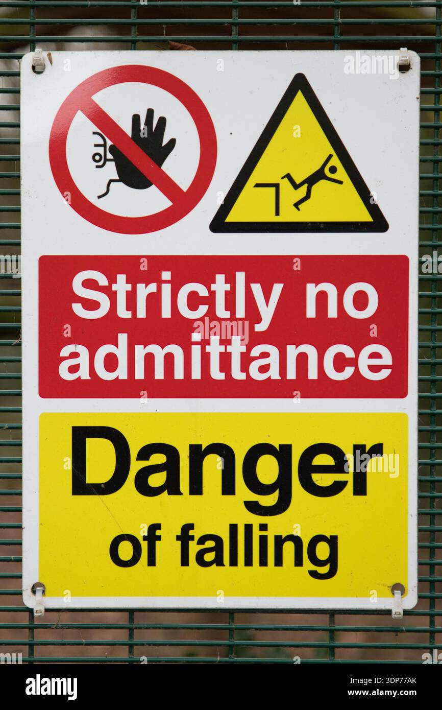 Safety Warning Sign Mounted on a Perimeter Fence Stock Photo - Alamy