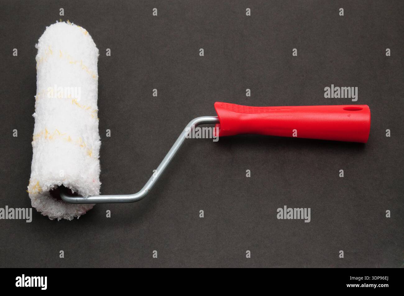 Painter roller for painting various surfaces Stock Photo