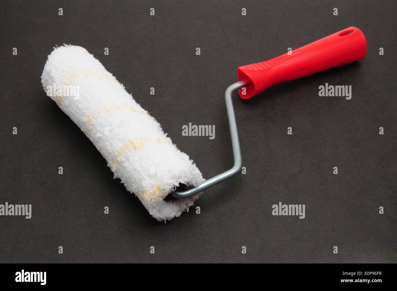 Painter roller for painting various surfaces Stock Photo