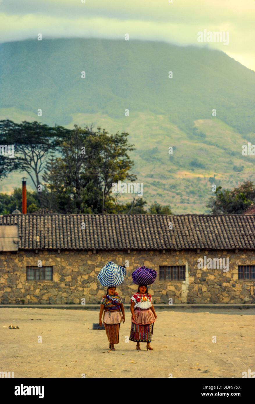 Women returning from the market on market day of a village near Antigua, Guatemala, April 1986. Stock Photo