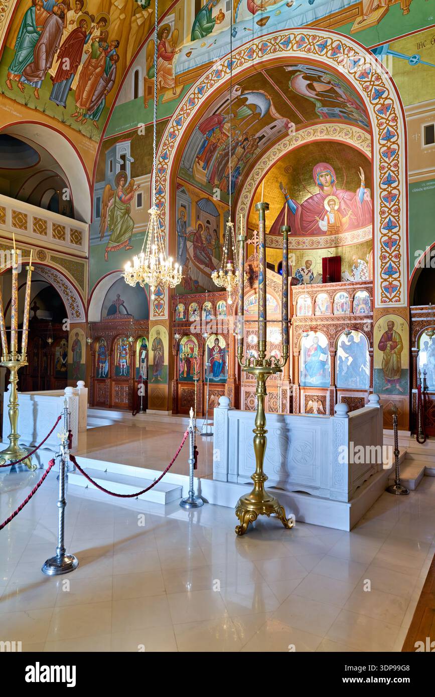 Interior of a vibrant Greek Orthodox church in Santorini, adorned with ...
