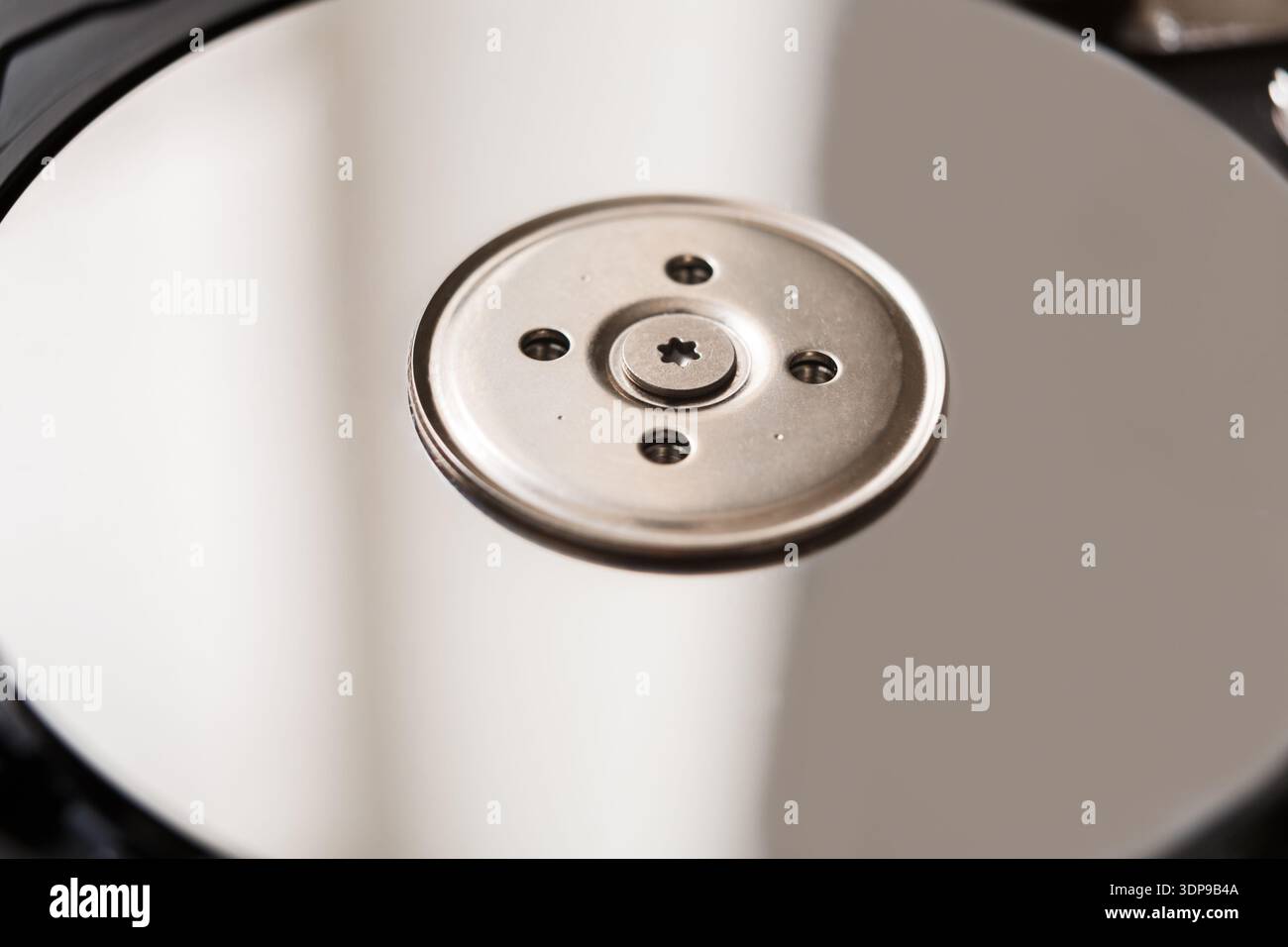 Computer hard drive dissasembled closeup Stock Photo