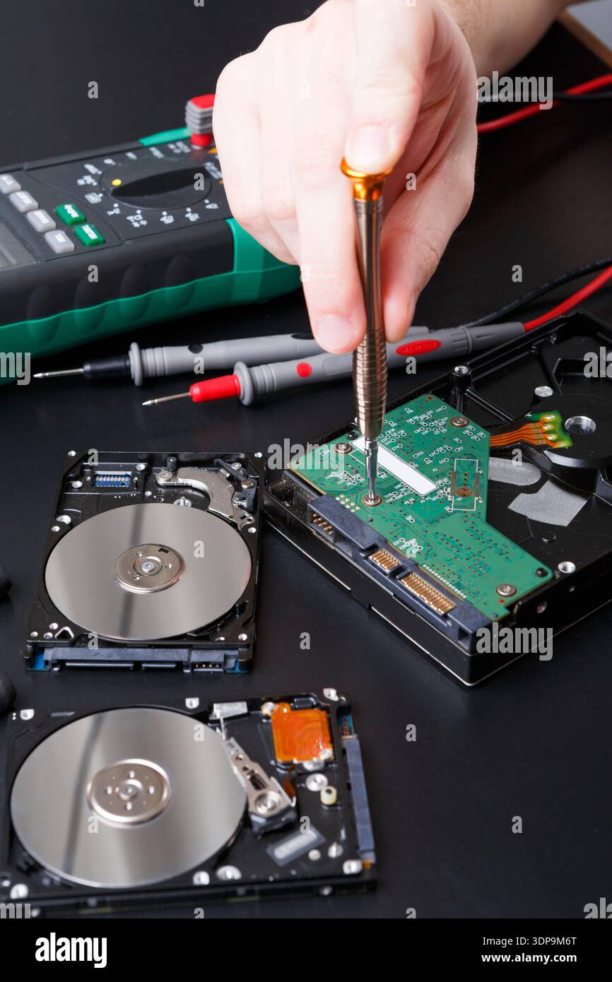 Hard disc drive disassembling close up Stock Photo
