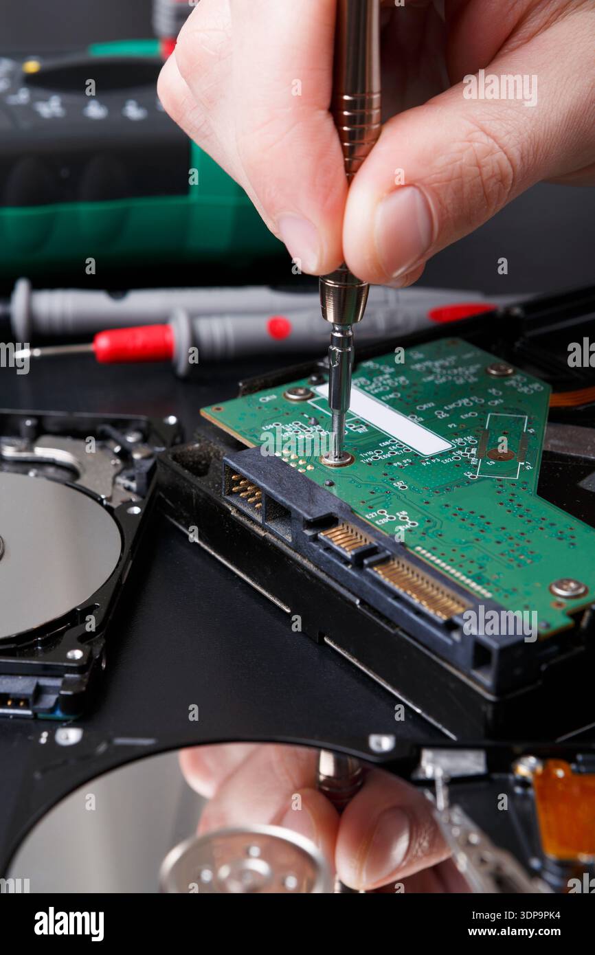 Hard disc drive disassembling close up Stock Photo