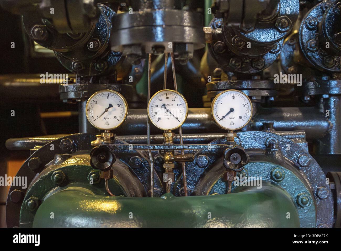 Detailed view of three pressure gauges on an industrial machinery in a ...