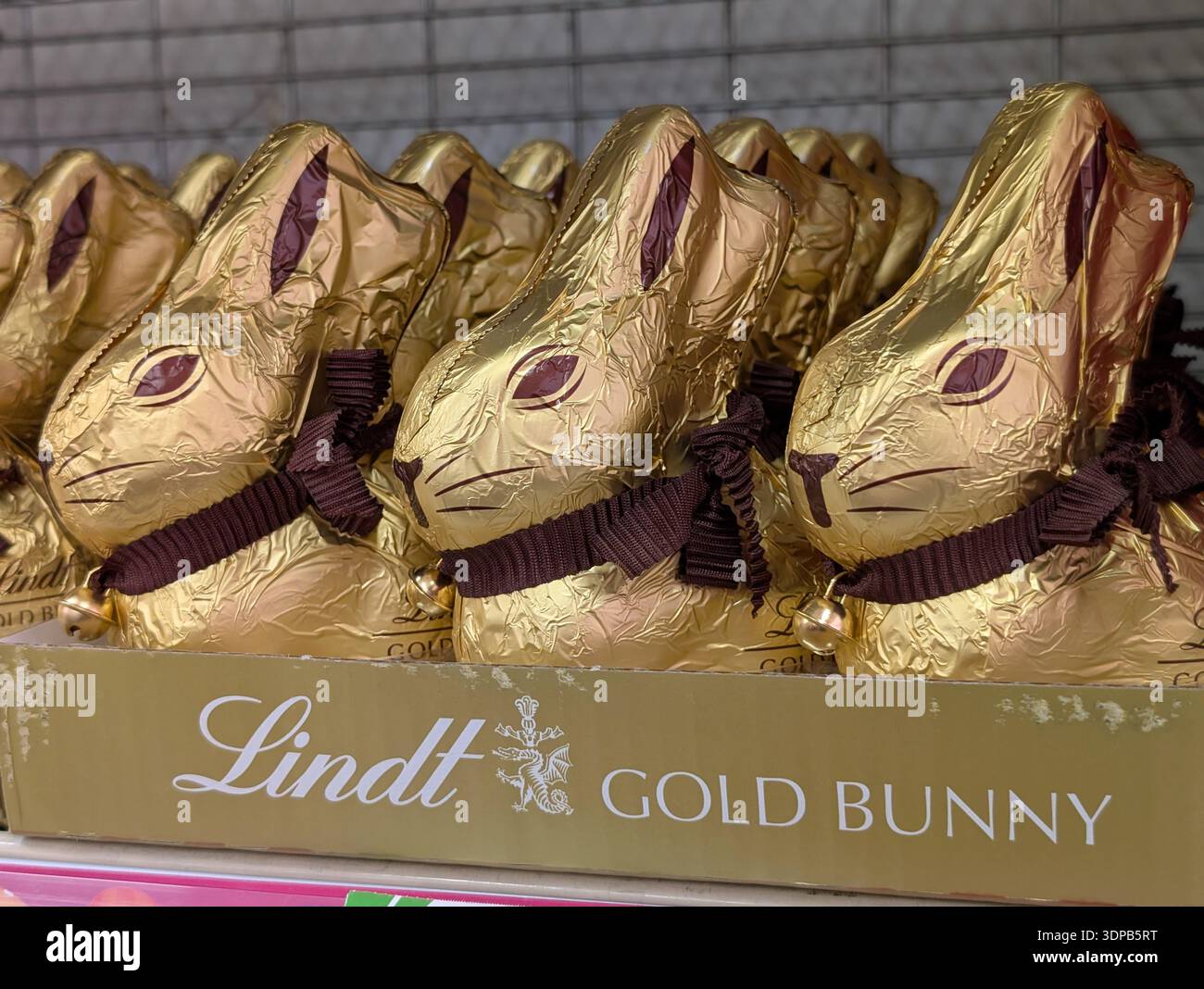 Lindt Gold Bunny chocolates on display inside a supermarket in Australia - Smartphone Captured Stock Image