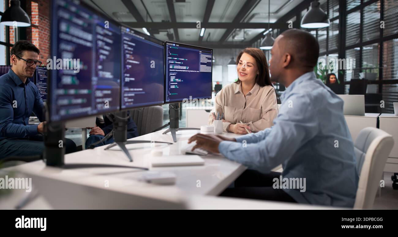 African American Software Engineer Leading Diverse Team In Computer Security. Stock Photo