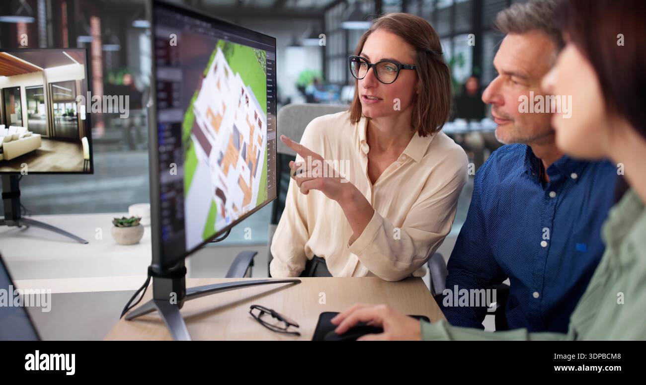 Senior Design Engineer And Real Estate Agent Collaborate On CAD Software Stock Photo