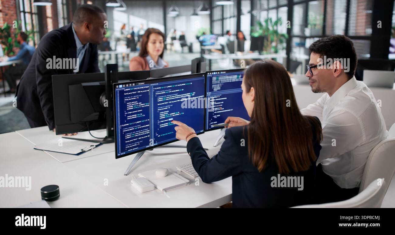 Agile Developing Team Codes New Software On Office Computer Screen Stock Photo
