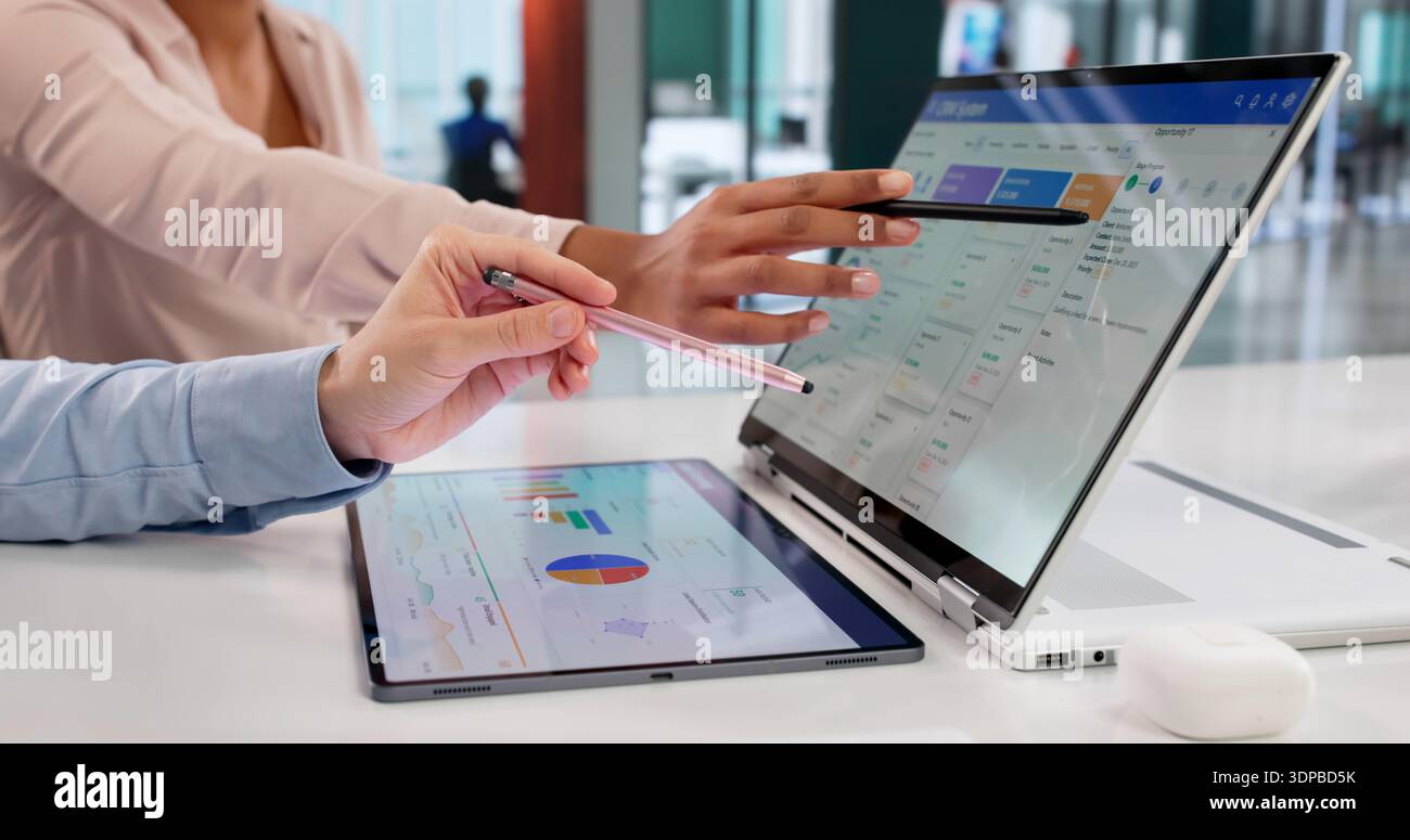 Digital Strategist Analyzing Sales Data On CRM Dashboard For Company. Stock Photo