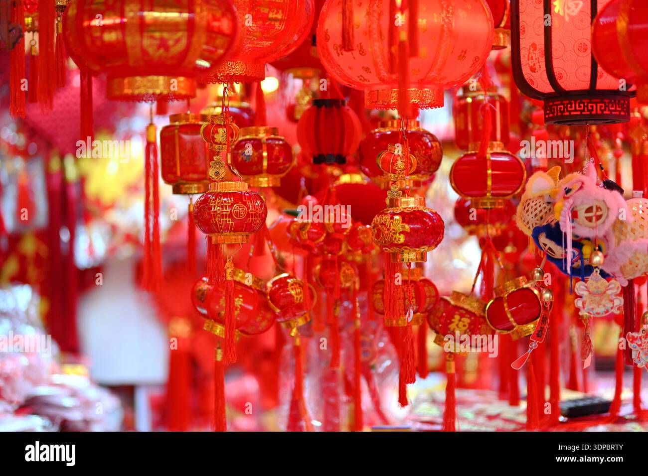 Shoppers select Spring Festival decorations at Beijing Baihong World ...