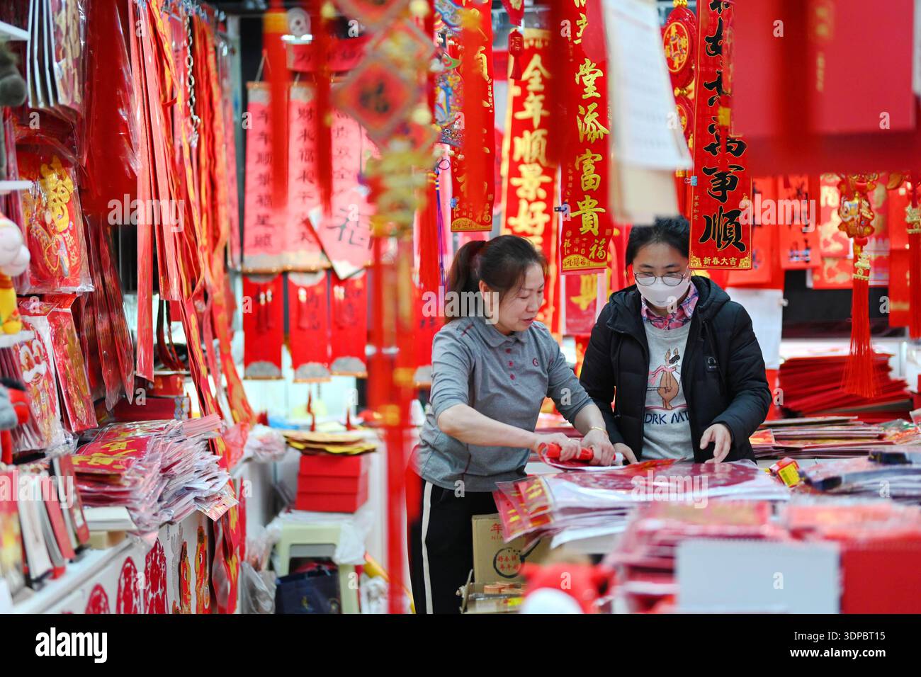 Shoppers select Spring Festival decorations at Beijing Baihong World ...