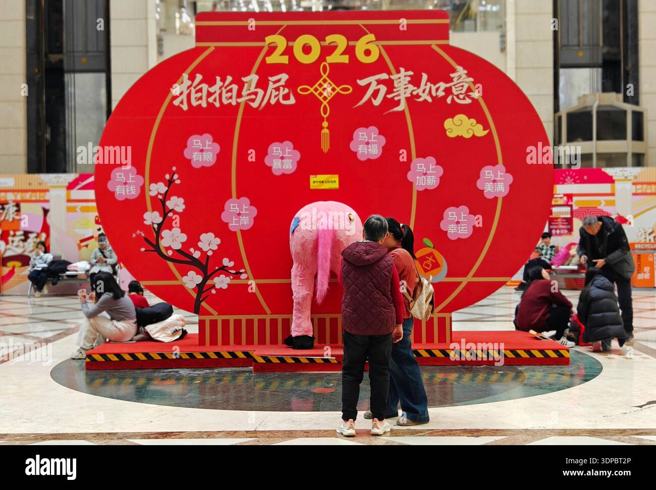 Shoppers select Spring Festival decorations at Beijing Baihong World ...