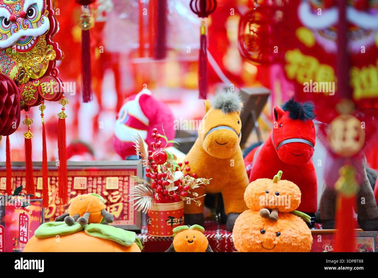 Shoppers select Spring Festival decorations at Beijing Baihong World ...