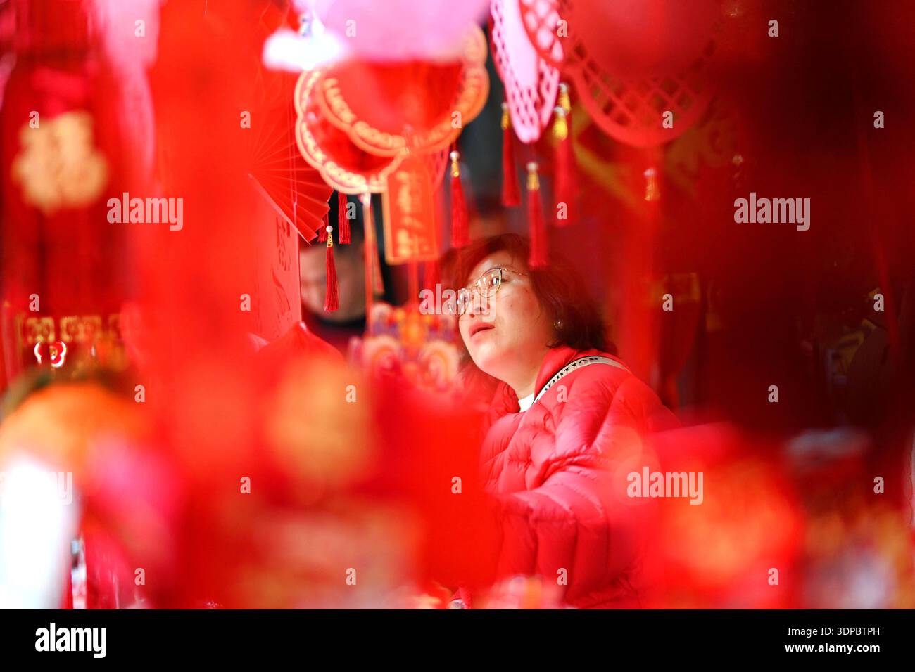 Shoppers select Spring Festival decorations at Beijing Baihong World ...