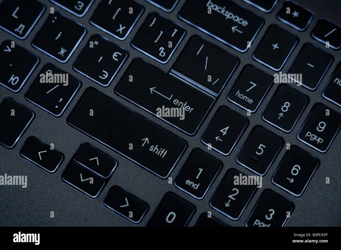 A close view shows a computer keyboard with keys highlighted. The ...