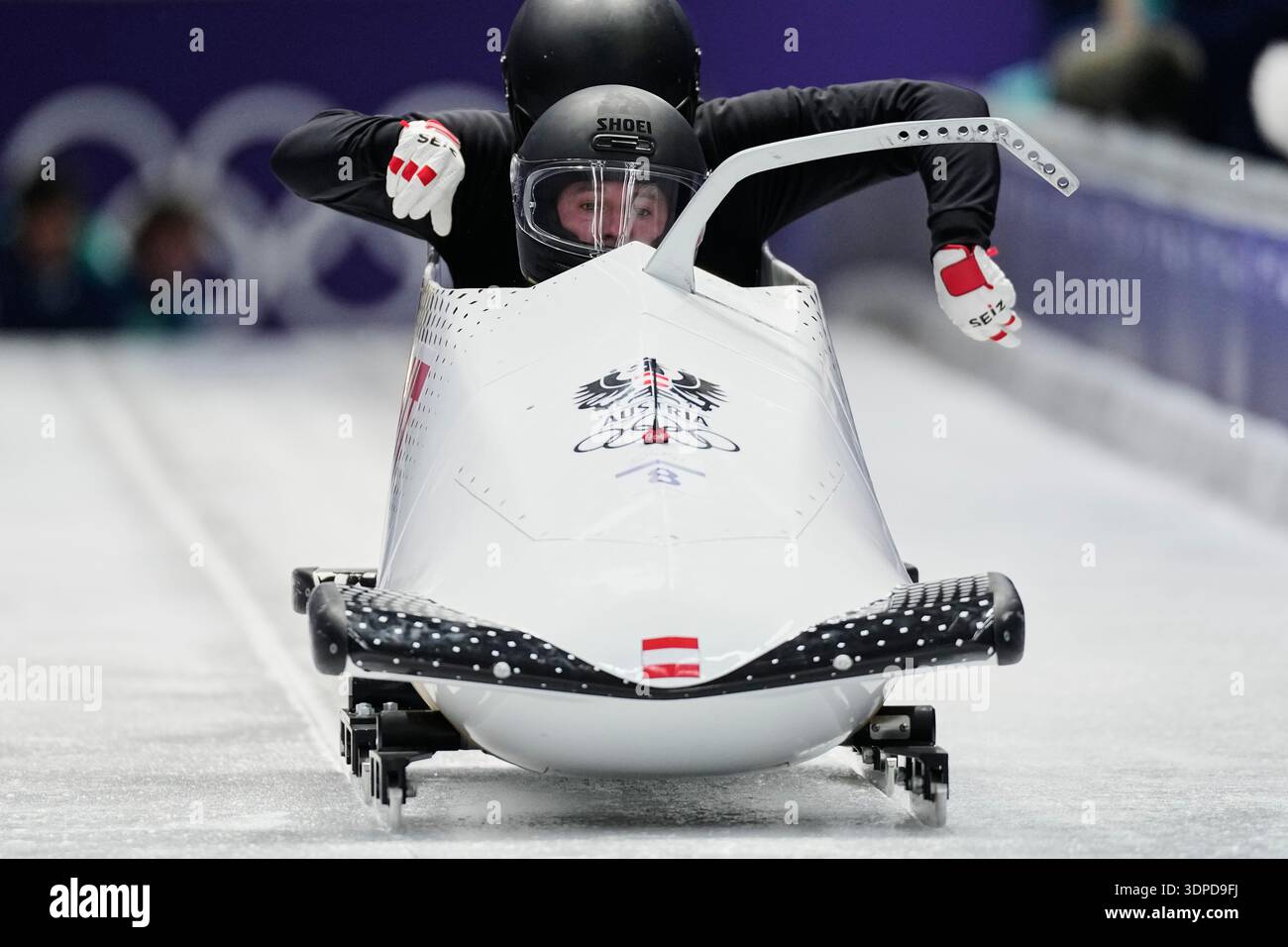 Austria's Jakob Mandlbauer, front, starts for a two man bobsled ...