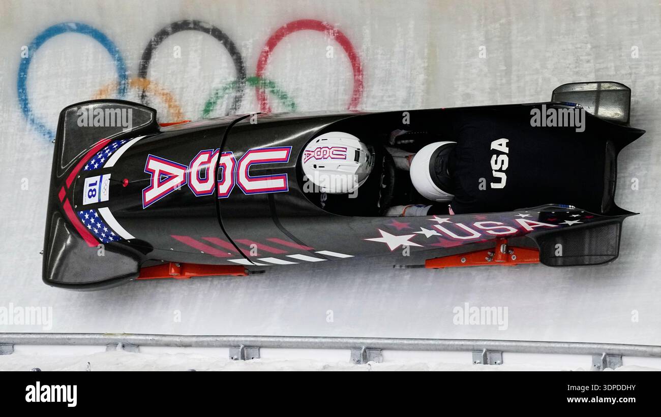 United States' Frankie del Duca, left, slides down the track during a ...