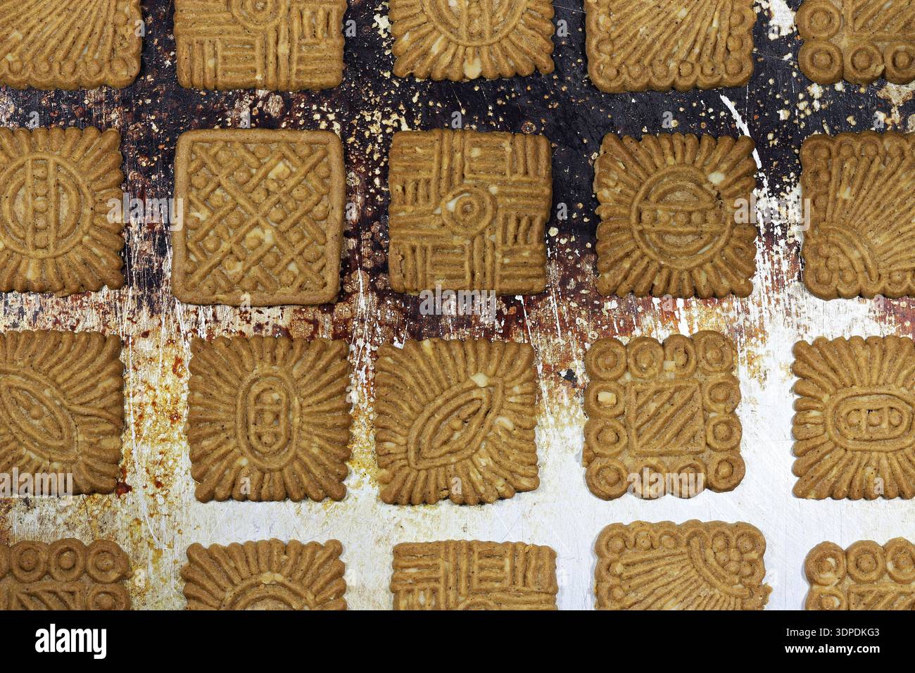 East Frisian ‘Braune Kuchen’ biscuits on baking tray Stock Photo