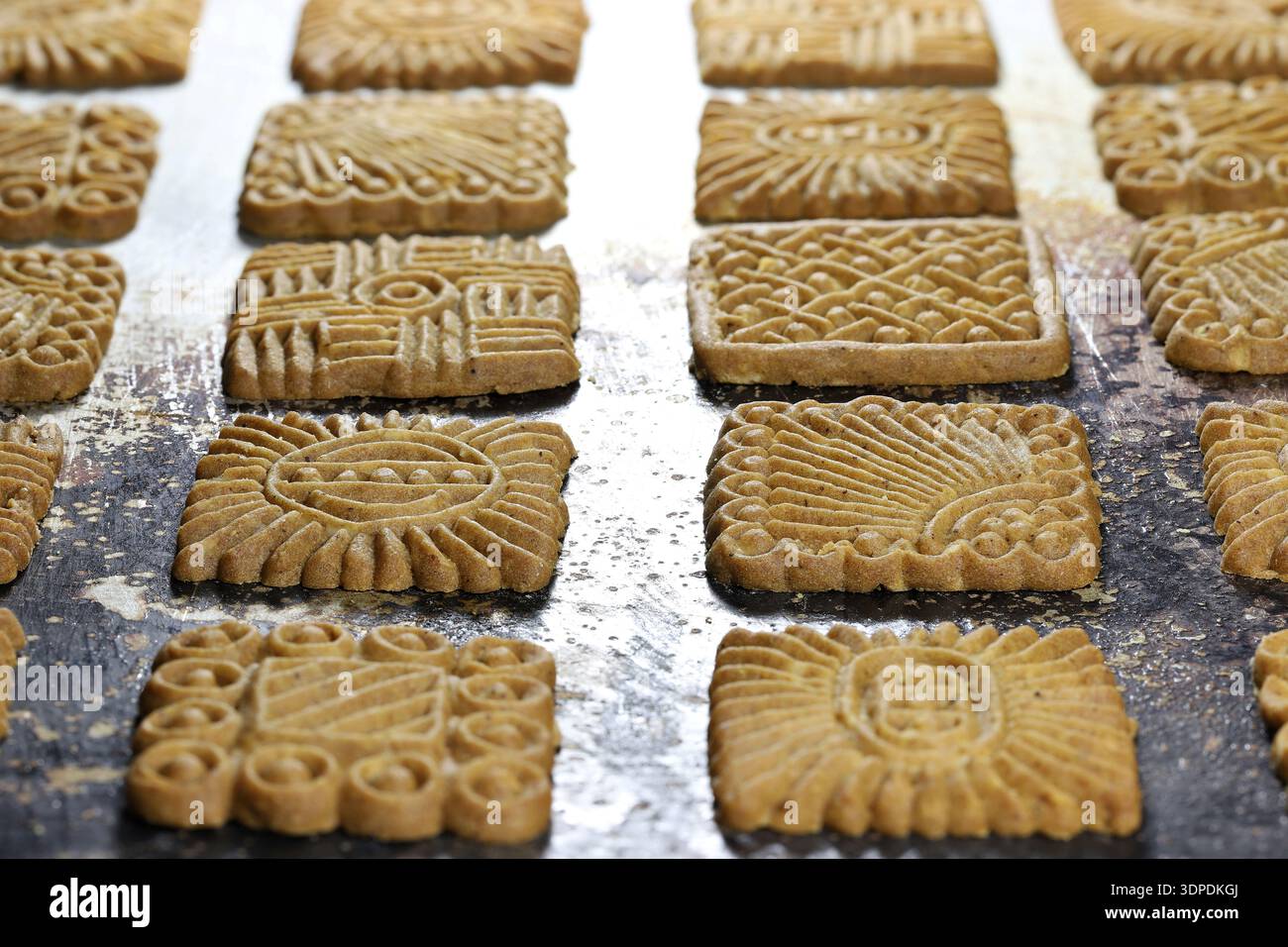 East Frisian ‘Braune Kuchen’ biscuits on baking tray Stock Photo