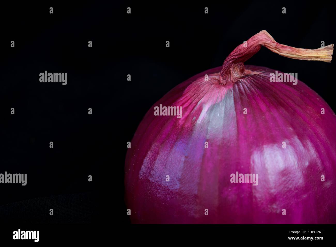 Red onion isolated on black background Stock Photo