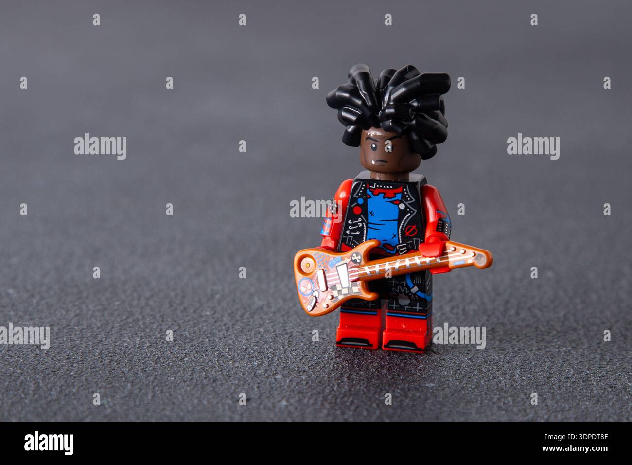 LEGO Hobie Brown Spider-Punk collectible minifigure from the Spider-Man Across the Spider-Verse series. Toy man on black background. Kyiv, Ukraine - January 8, 2026 Stock Photo