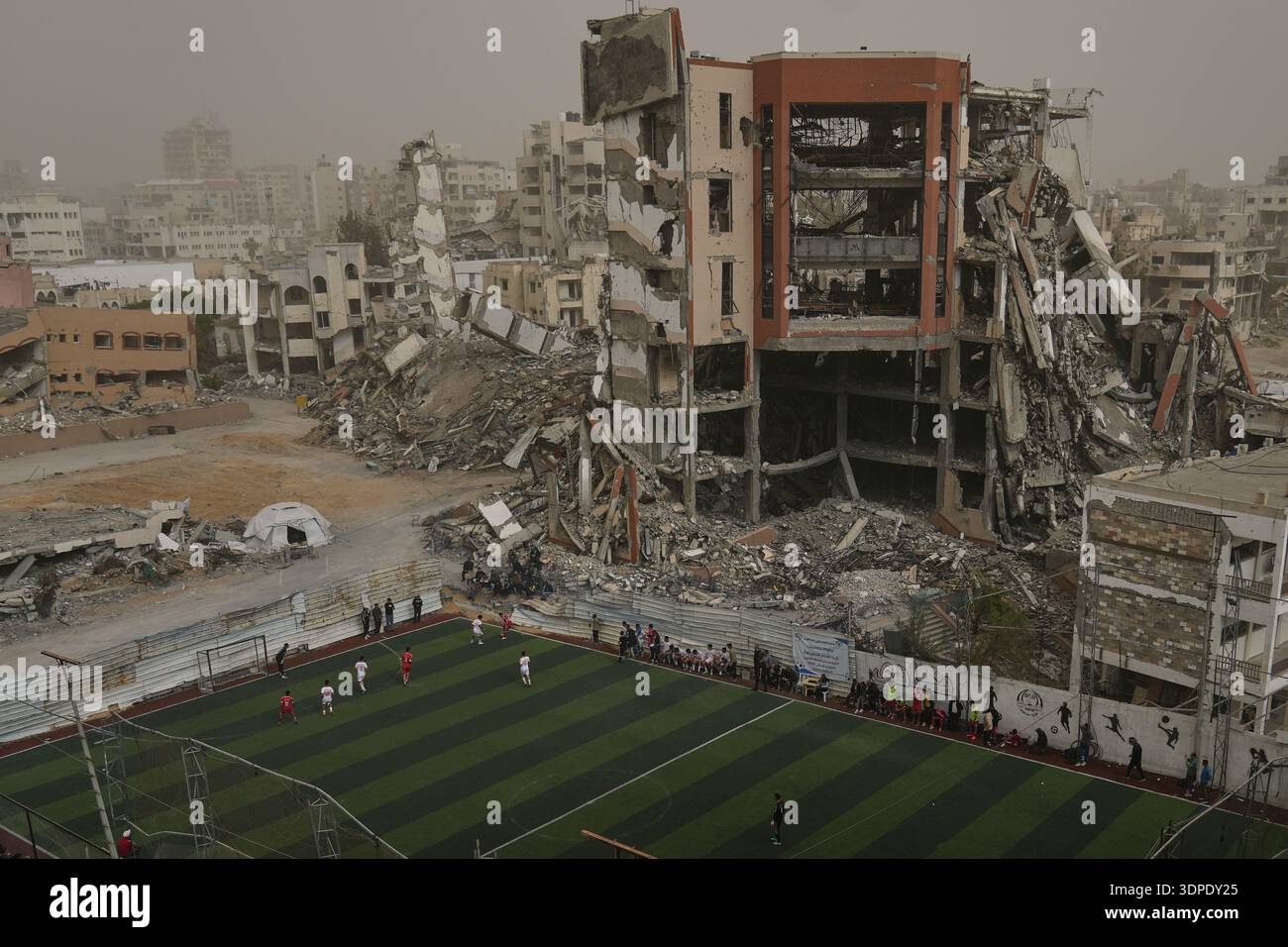 Palestinian players of Gaza Sports Club and Al-Ahly Club take part in a ...